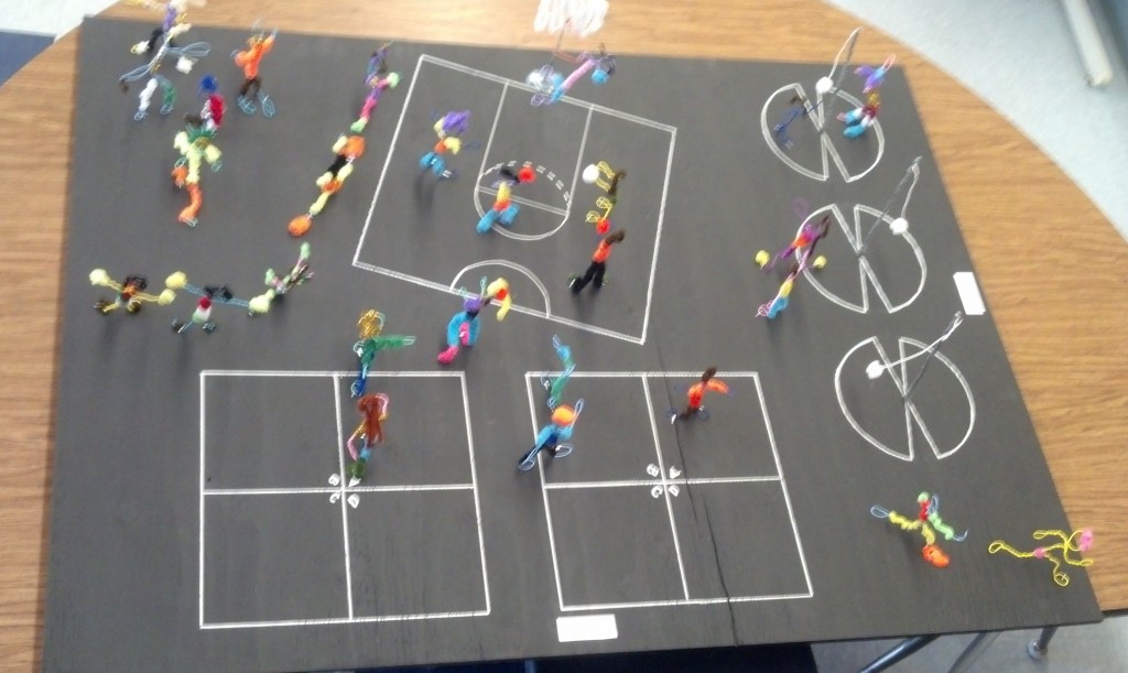 It's Clifford's blacktop in miniature, populated with wire stick-like figures.