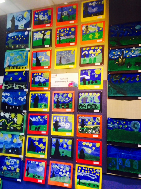 In the downtown Redwood City library: 3rd Grade students paint their version of a nighttime scene, inspired by Vincent Van Gogh's Starry Night.